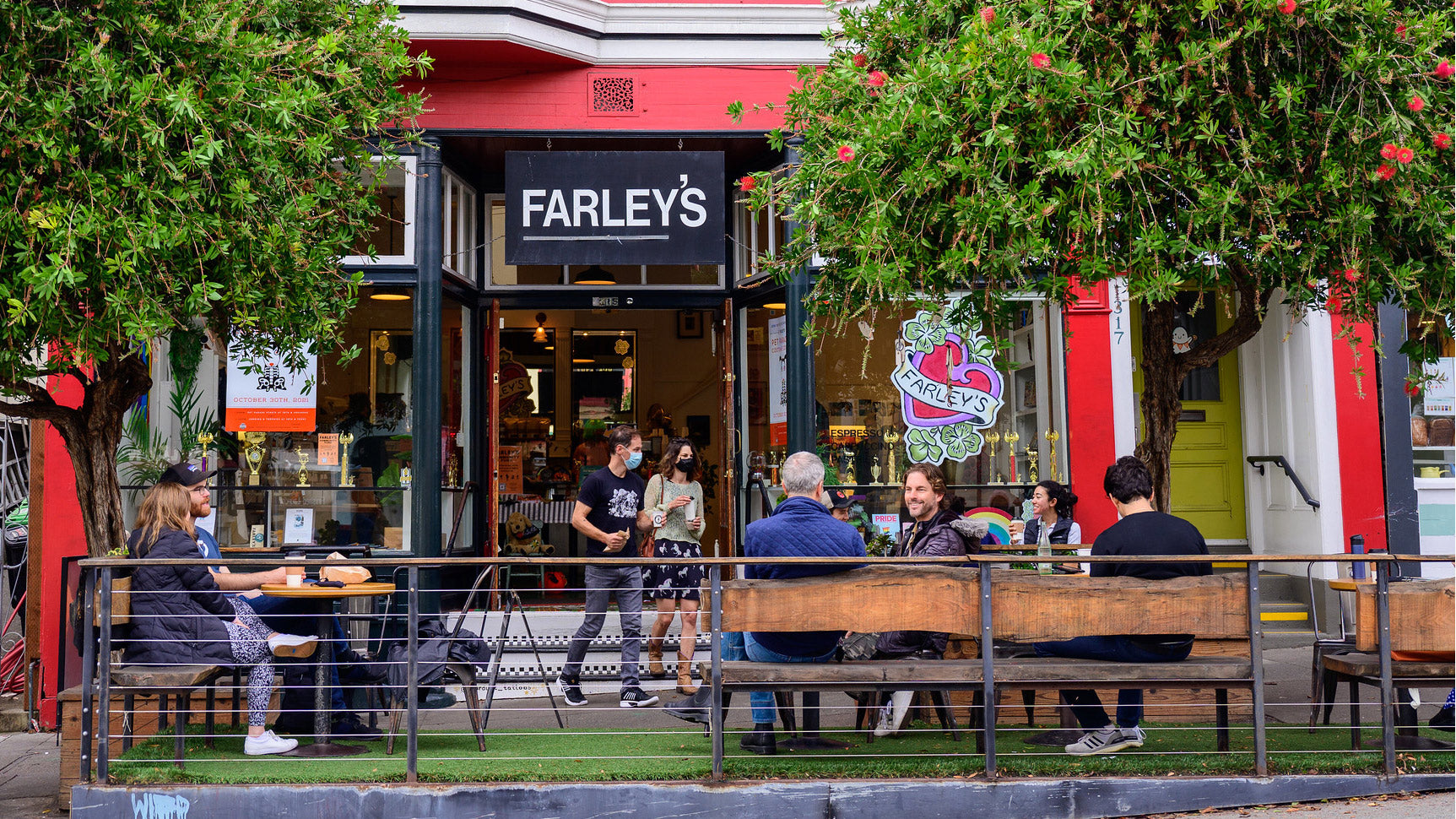 Front view of Farley's cafe with people seated outside drinking coffee.
